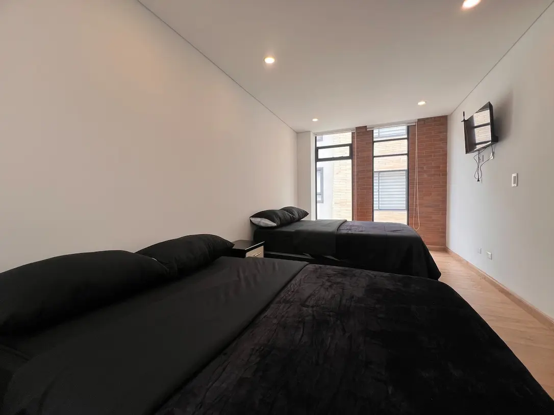 Zona de descanso del apartamento 301 con camas dobles